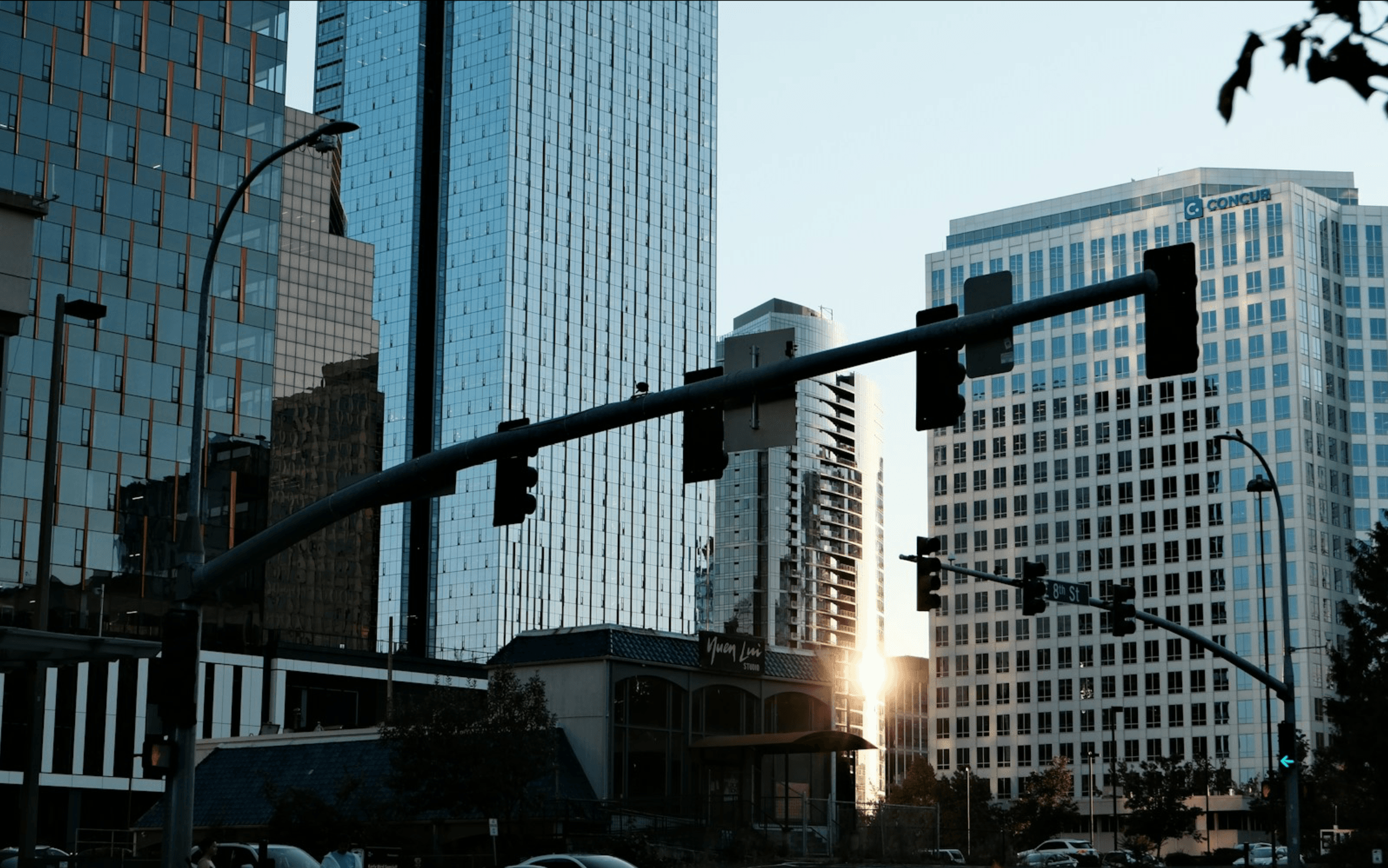 Glass office towers in a city business district at golden hour